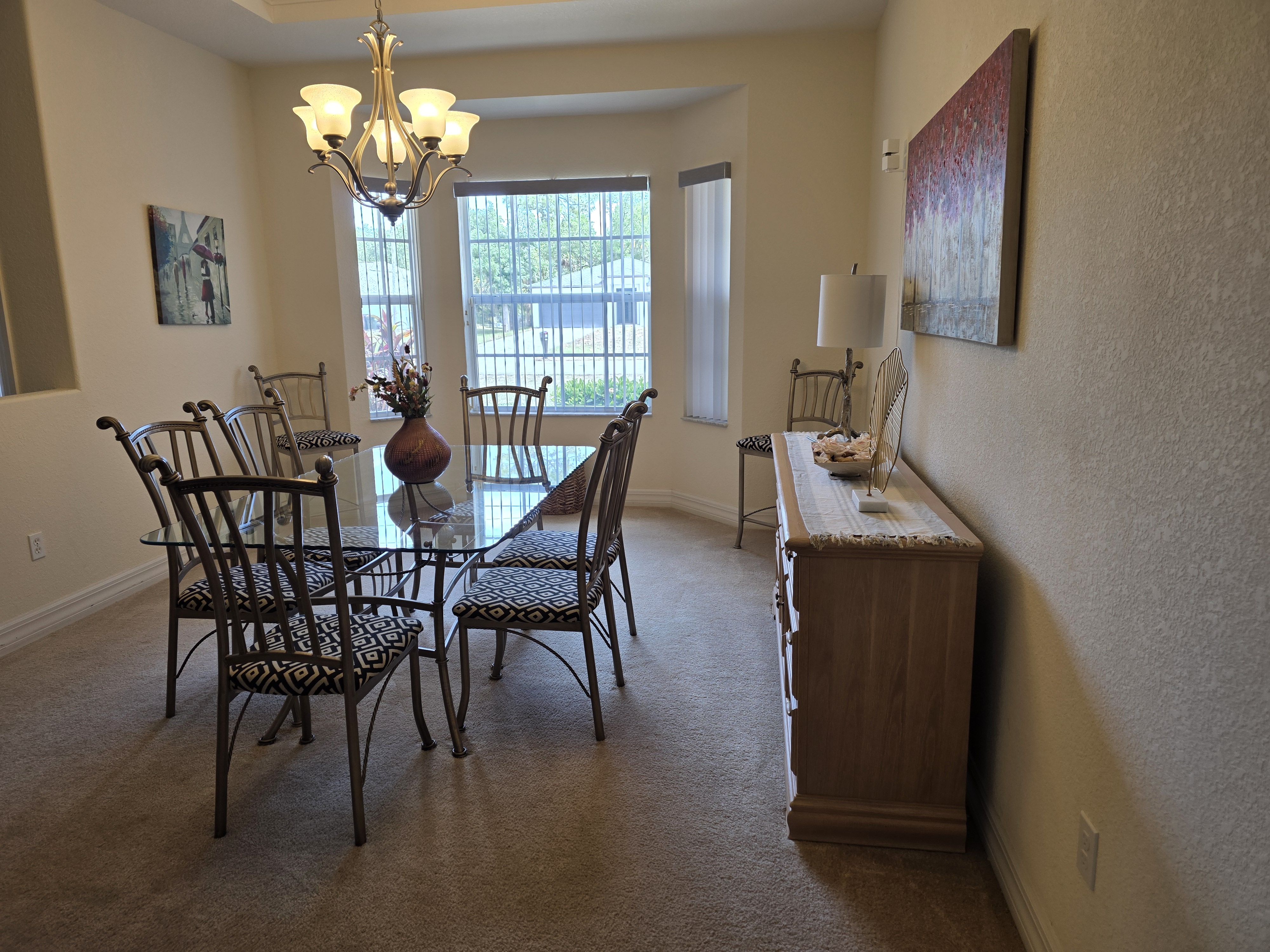 Dining room table viewed toward the windows
