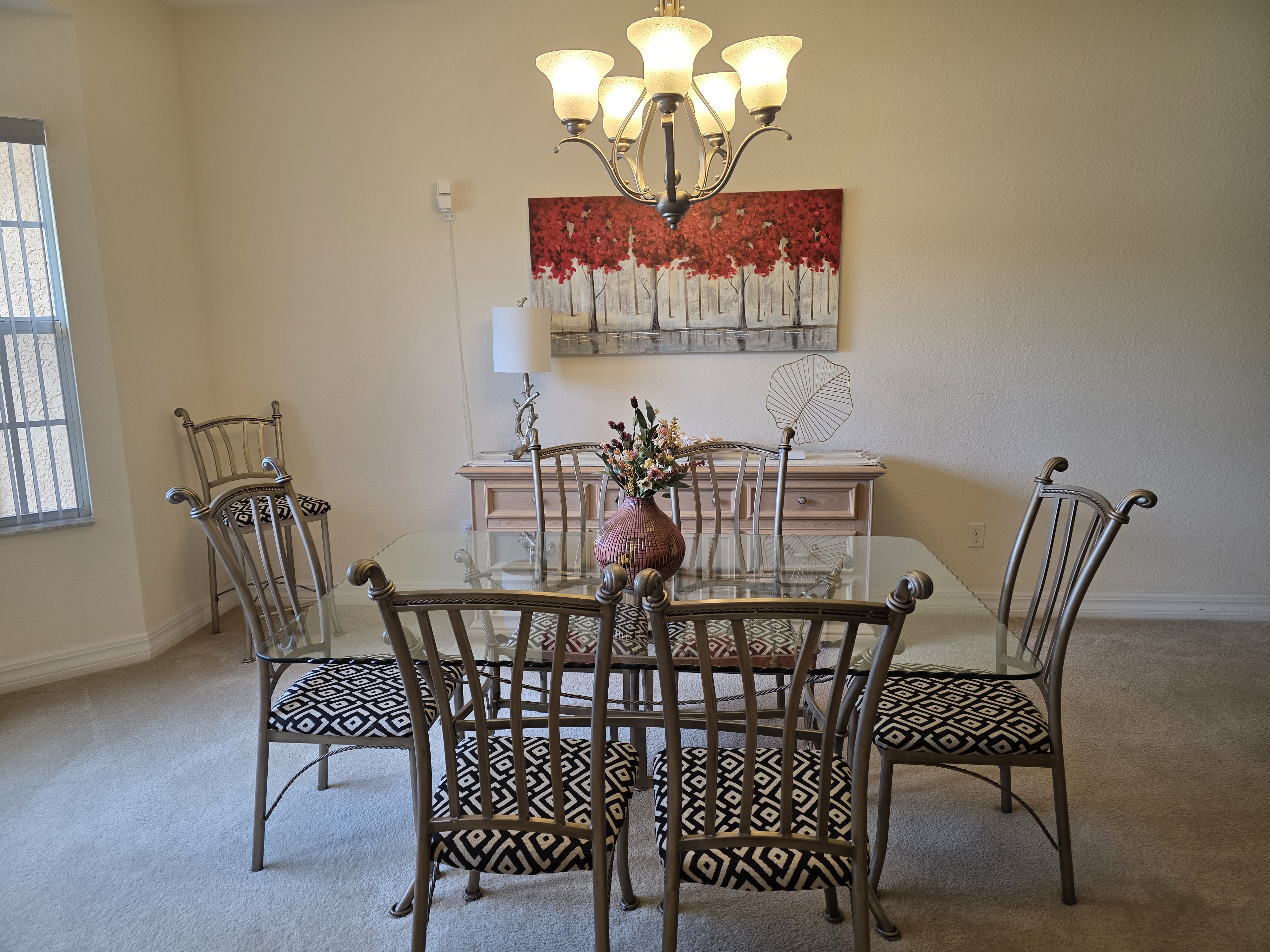 Dining room table and red wall art